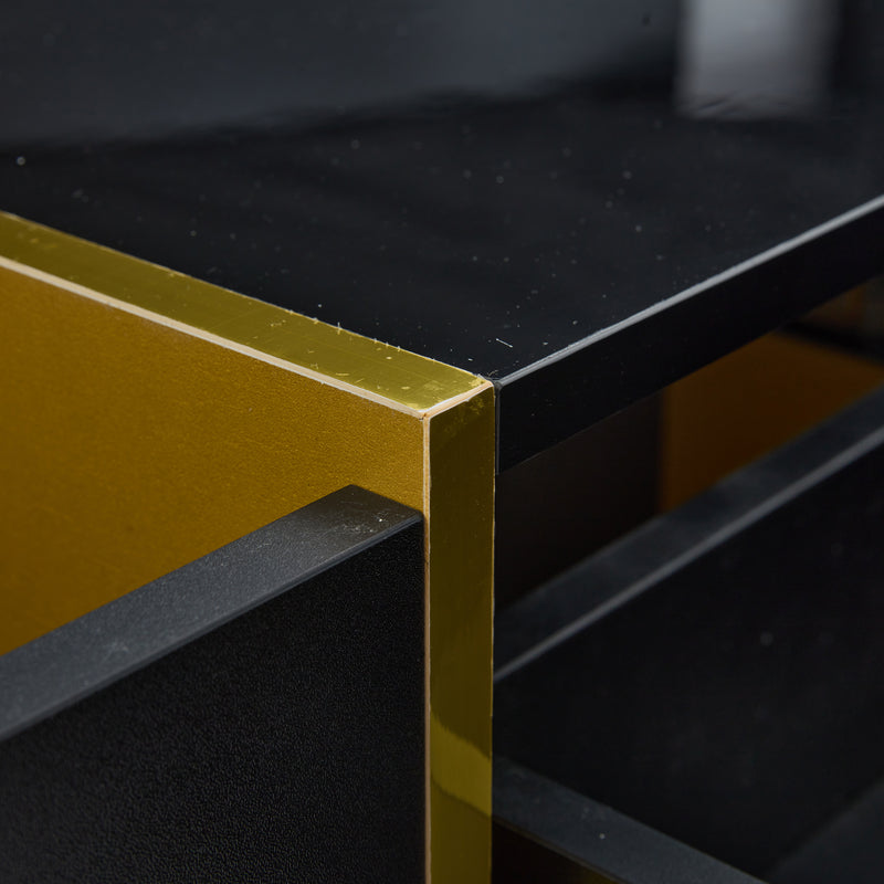 Table basse rectangulaire noire brillant 4 tiroirs accents dorés YIHRETH